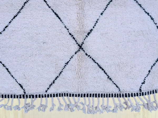 Classic Diamond Beni Ourain rug with black diamond patterns on an ivory background, handwoven from 100% wool, perfect for modern home decor