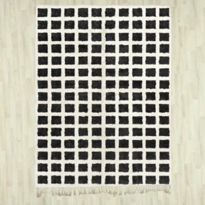 A black and white checkerd Beni Ourain rug featuring a bold grid pattern, handwoven with 100% natural wool, displayed on a wooden floor