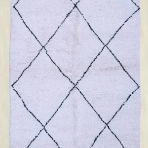 Classic Diamond Beni Ourain rug featuring a minimalist black diamond pattern on a soft ivory background. Handwoven from 100% wool, perfect for modern interiors